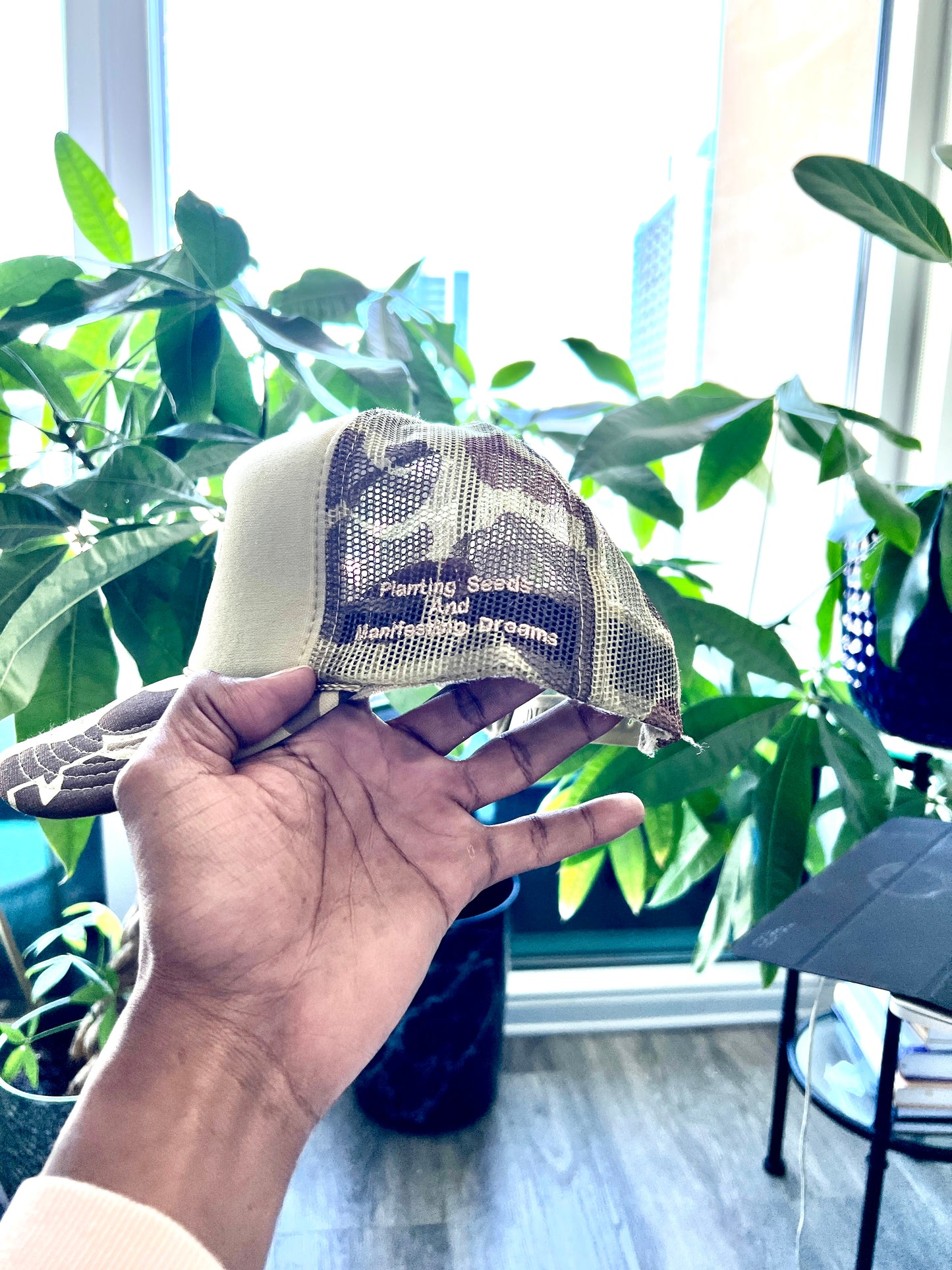 PLVNTD P Trucker hat